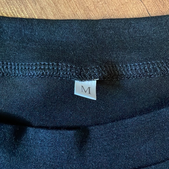 Long sleeve black t-shirt with block patterned arms. - Picture 4 of 4